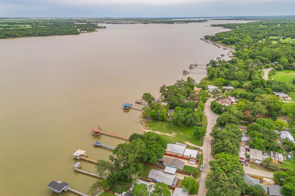 14064 Rucker Street Azle, TX 76020 - Photo 5 of 40 an aerial view of a house with a yard and lake view