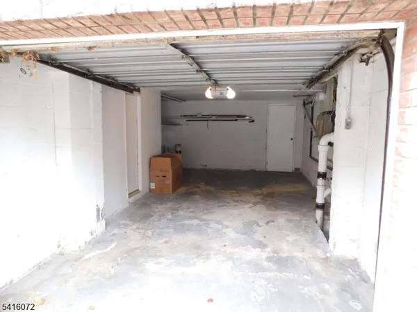 a view of a hallway with stairs