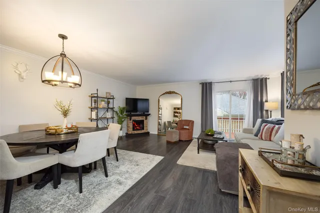 a view of a livingroom with furniture window and wooden floor