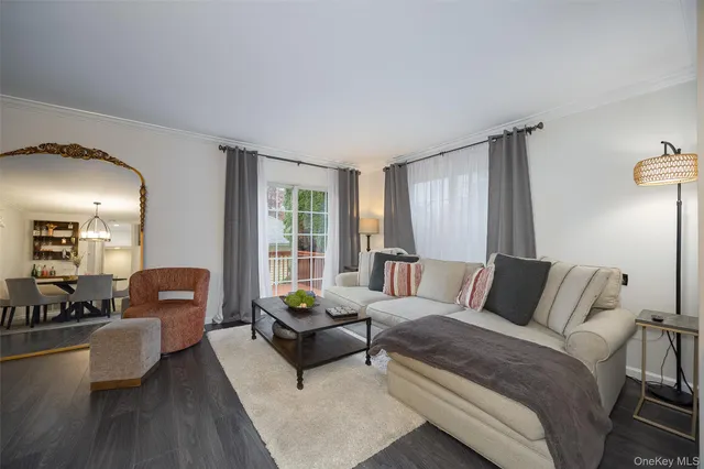 a bedroom with furniture and wooden floor