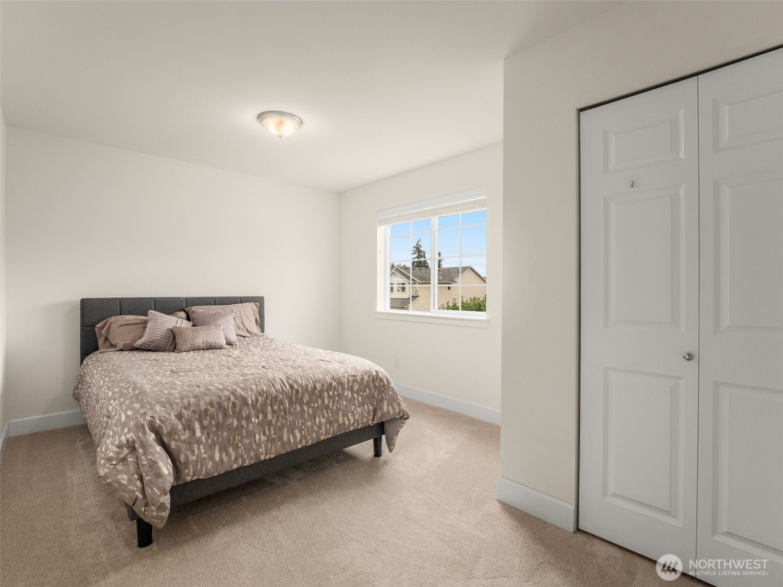 4620 151st Place Southeast Bothell, WA 98012 - Photo 15 of 33 a bedroom with a bed and a painting on the wall