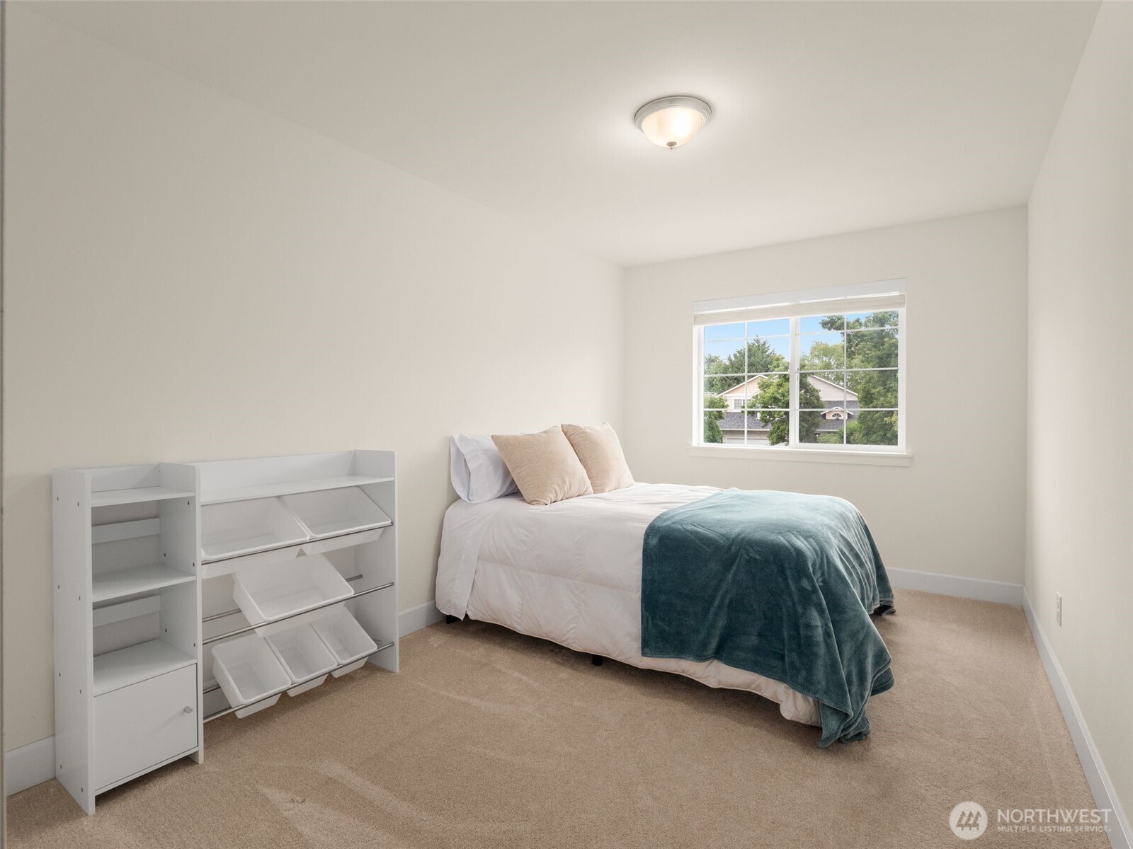 4620 151st Place Southeast Bothell, WA 98012 - Photo 16 of 33 a spacious bedroom with a bed and a window