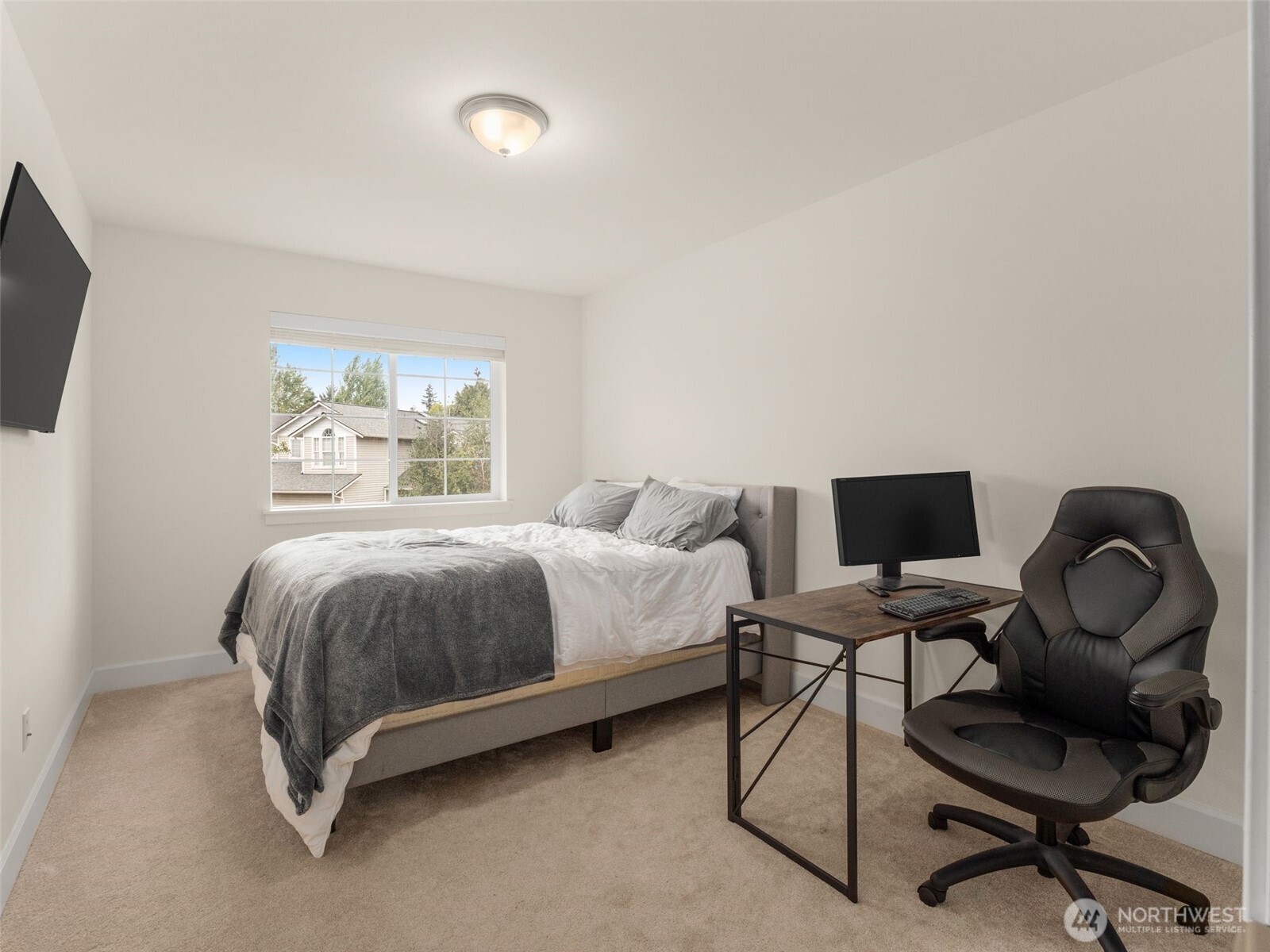 4620 151st Place Southeast Bothell, WA 98012 - Photo 18 of 33 a spacious bedroom with a bed chair and a window