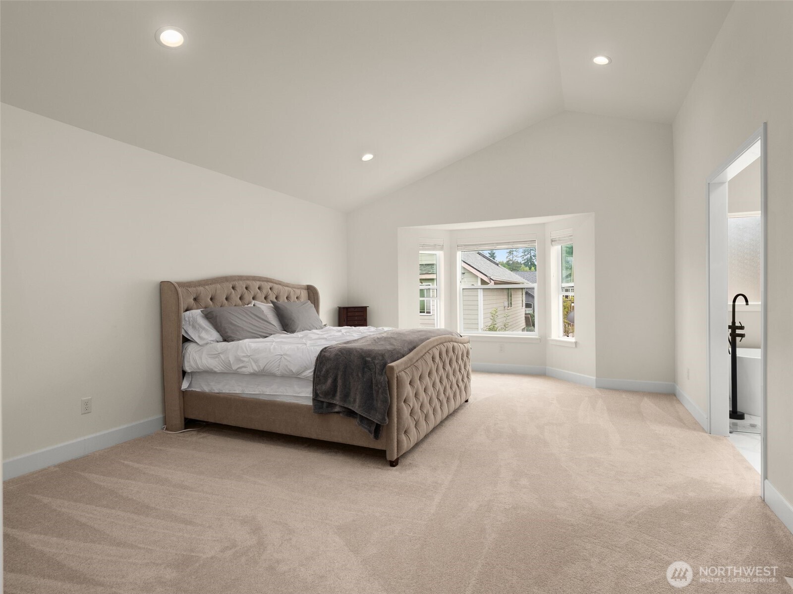 4620 151st Place Southeast Bothell, WA 98012 - Photo 23 of 33 a bedroom with a large bed and wooden floor