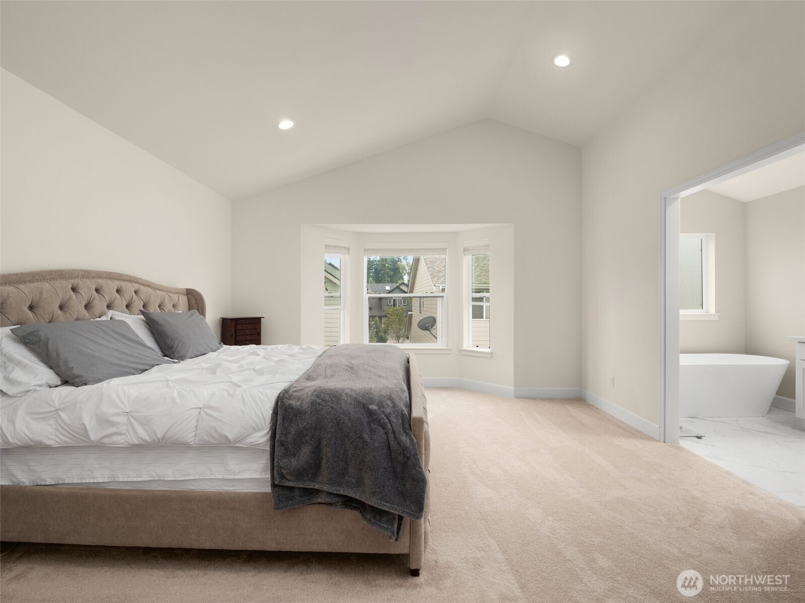 4620 151st Place Southeast Bothell, WA 98012 - Photo 24 of 33 a spacious bedroom with a large bed and a couch