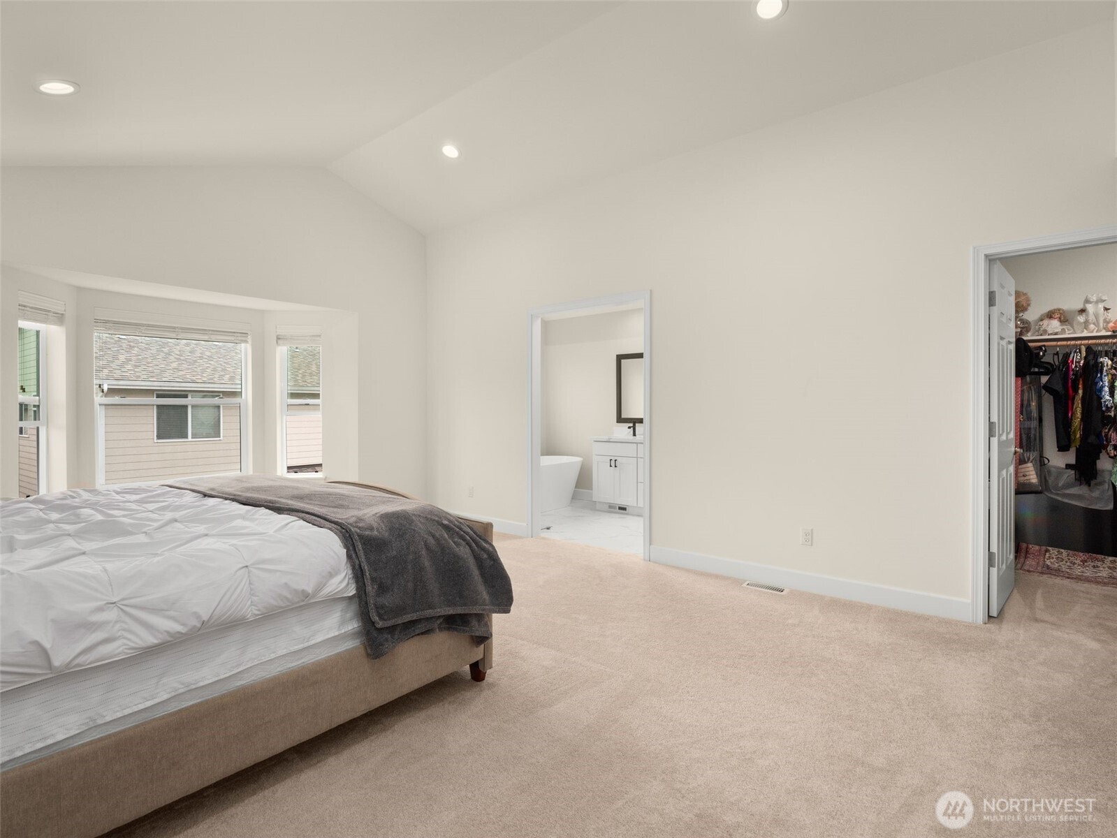 4620 151st Place Southeast Bothell, WA 98012 - Photo 25 of 33 a spacious bedroom with a bed and cabinets