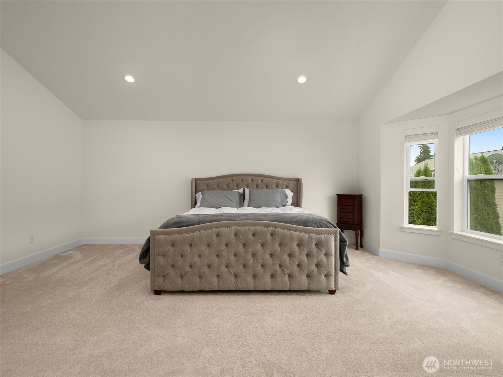 4620 151st Place Southeast Bothell, WA 98012 - Photo 26 of 33 a spacious bedroom with a bed and windows