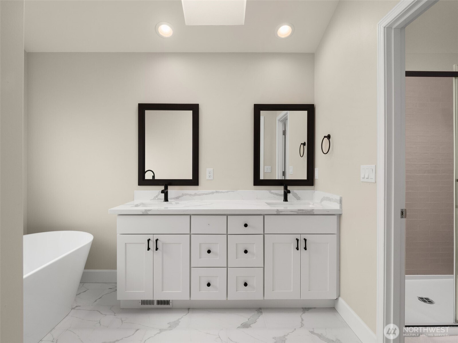 4620 151st Place Southeast Bothell, WA 98012 - Photo 27 of 33 a bathroom with 2 sink tub and a mirror