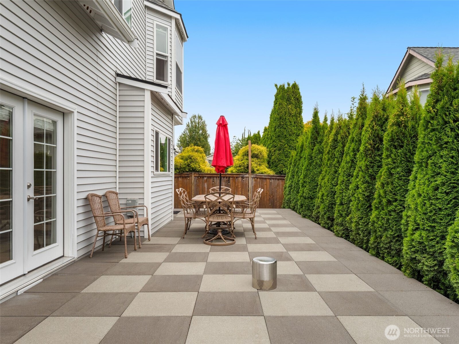 4620 151st Place Southeast Bothell, WA 98012 - Photo 31 of 33 a view of a patio with table and chairs and potted plants