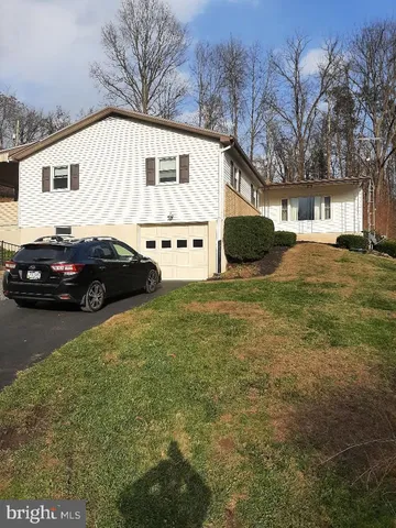 a view of a house with a back yard