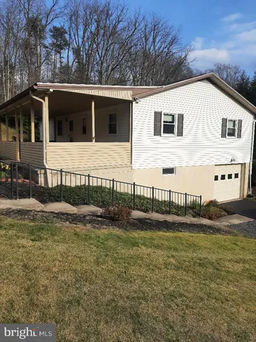 a view of a house with a big yard