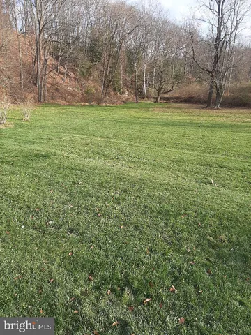 a view of outdoor space with deck and yard