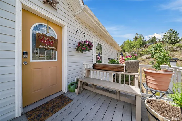 a kitchen with stainless steel appliances granite countertop a refrigerator a stove oven a sink dishwasher and white cabinets with wooden floor