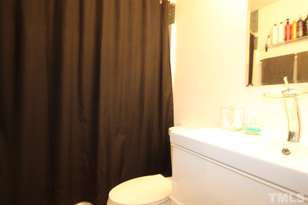 2501 Lilymount Drive Raleigh, NC 27610 - Photo 8 of 10 a bathroom with a sink and a toilet