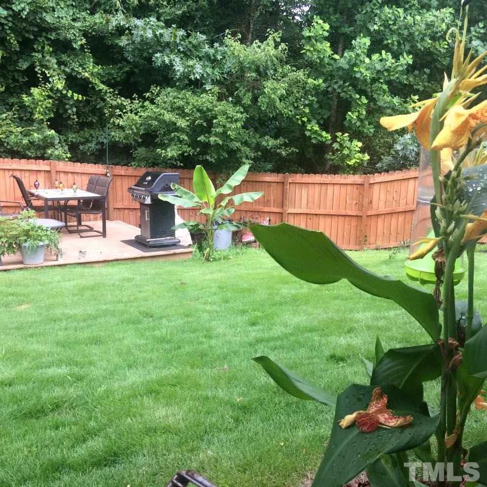 2501 Lilymount Drive Raleigh, NC 27610 - Photo 10 of 10 a view of a garden with a house