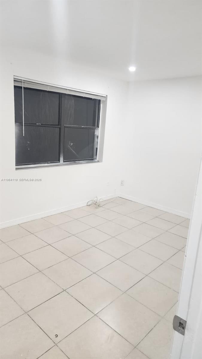 4108 Riverside Drive, Unit 2 Coral Springs, FL 33065 - Photo 5 of 11 a view of wooden cabinets