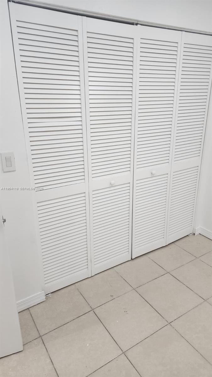 4108 Riverside Drive, Unit 2 Coral Springs, FL 33065 - Photo 7 of 11 an empty room with a window