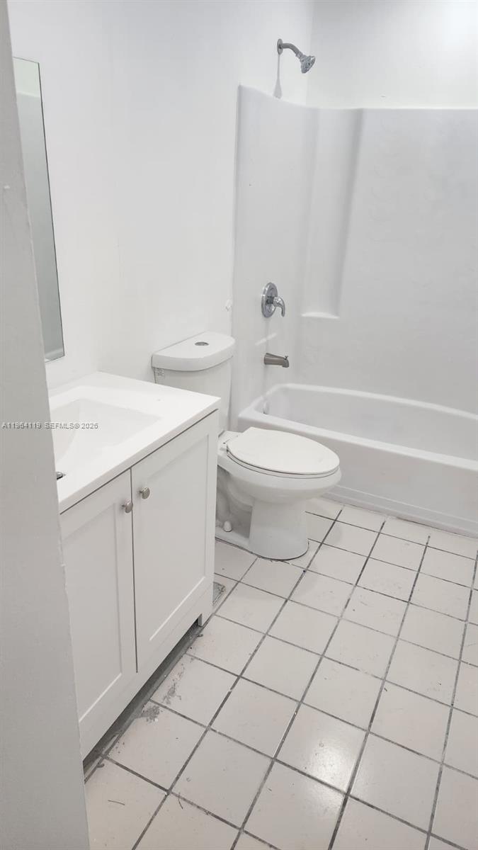 4108 Riverside Drive, Unit 2 Coral Springs, FL 33065 - Photo 10 of 11 a bathroom with a toilet a sink and bathtub