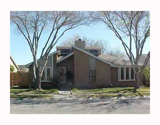 a house that has a tree in front of it