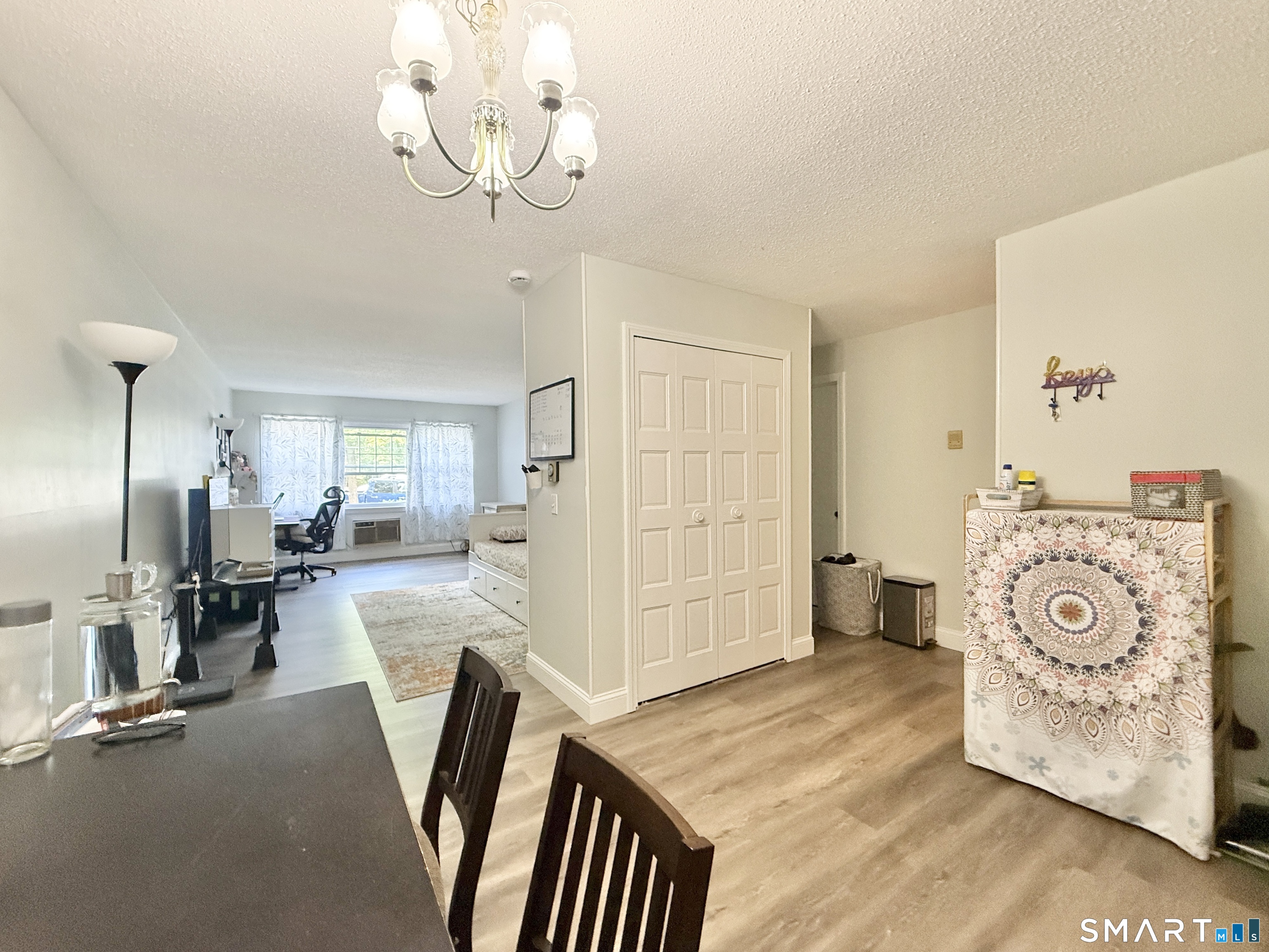 34 A Padanaram Road, Unit 127 Danbury, CT 06811 - Photo 2 of 13 a view of a livingroom with furniture