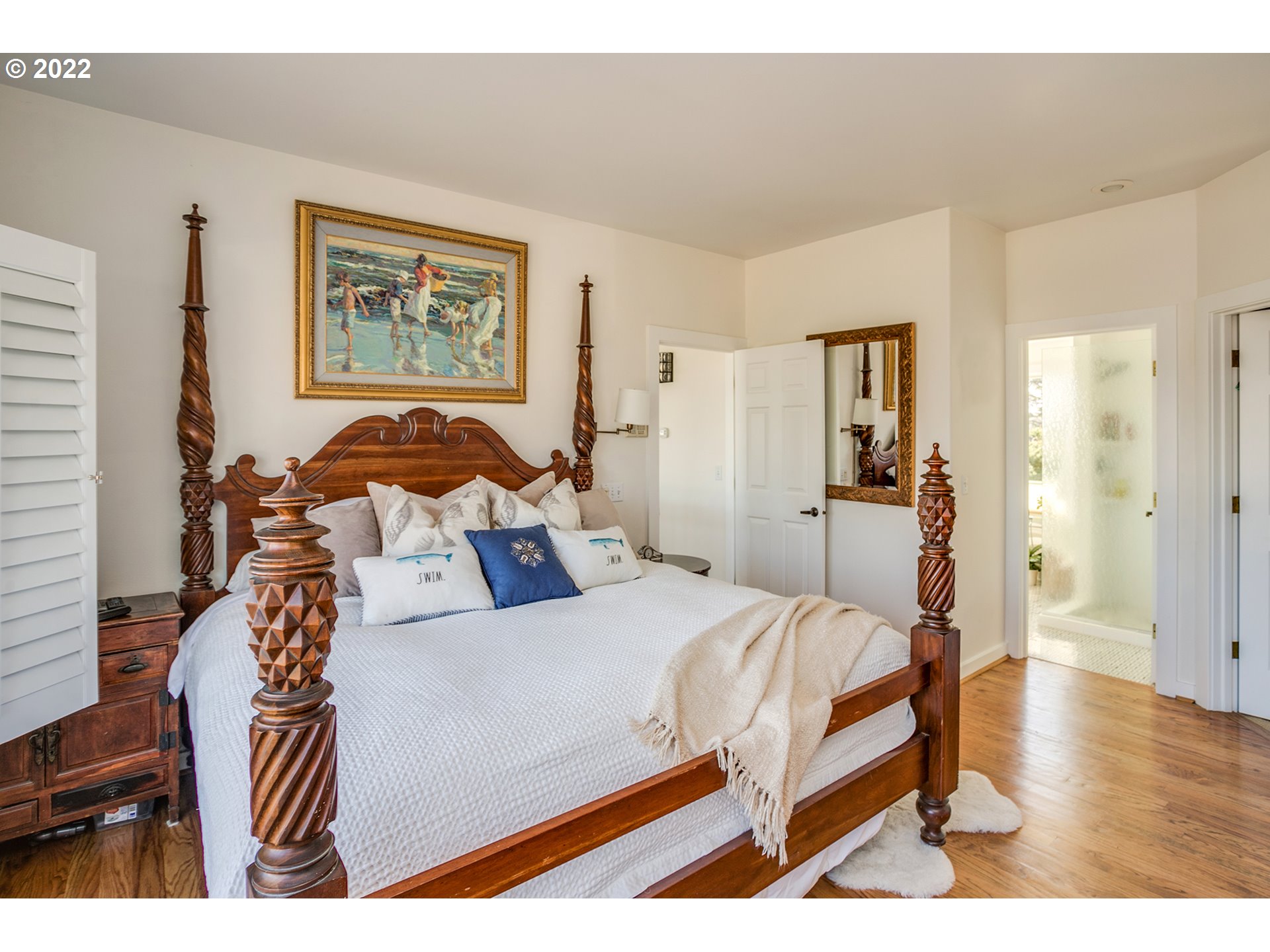 4805 High Ridge Road Gearhart, OR 97138 - Photo 12 of 29 a bedroom with a bed and a painting on the wall