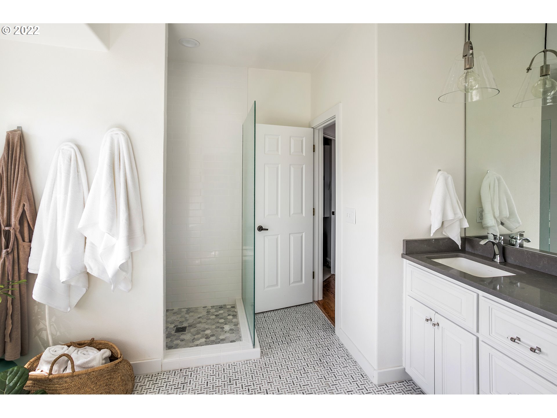 4805 High Ridge Road Gearhart, OR 97138 - Photo 14 of 29 a bathroom with a double vanity sink and mirror
