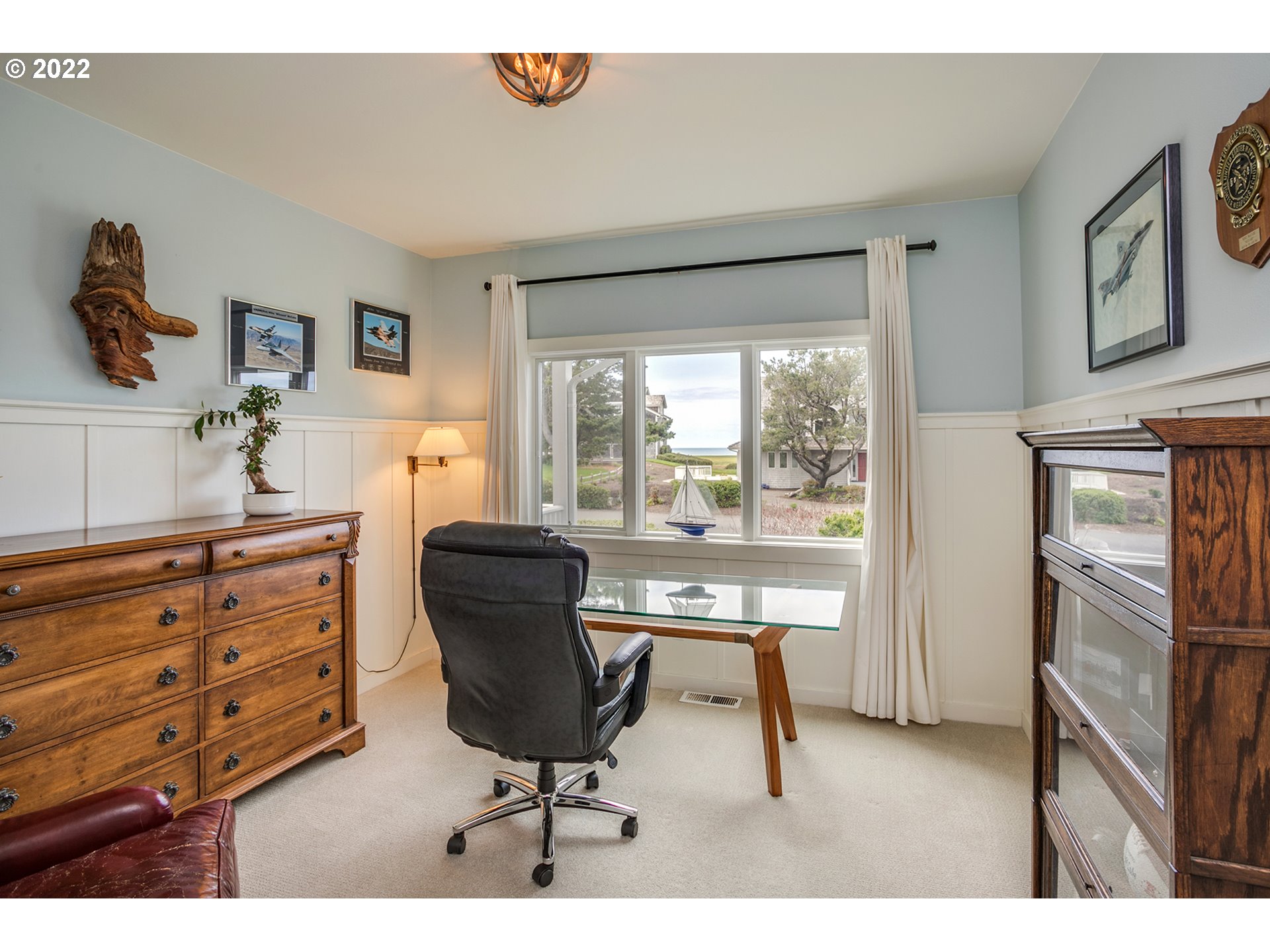 4805 High Ridge Road Gearhart, OR 97138 - Photo 18 of 29 a living room with furniture and a window