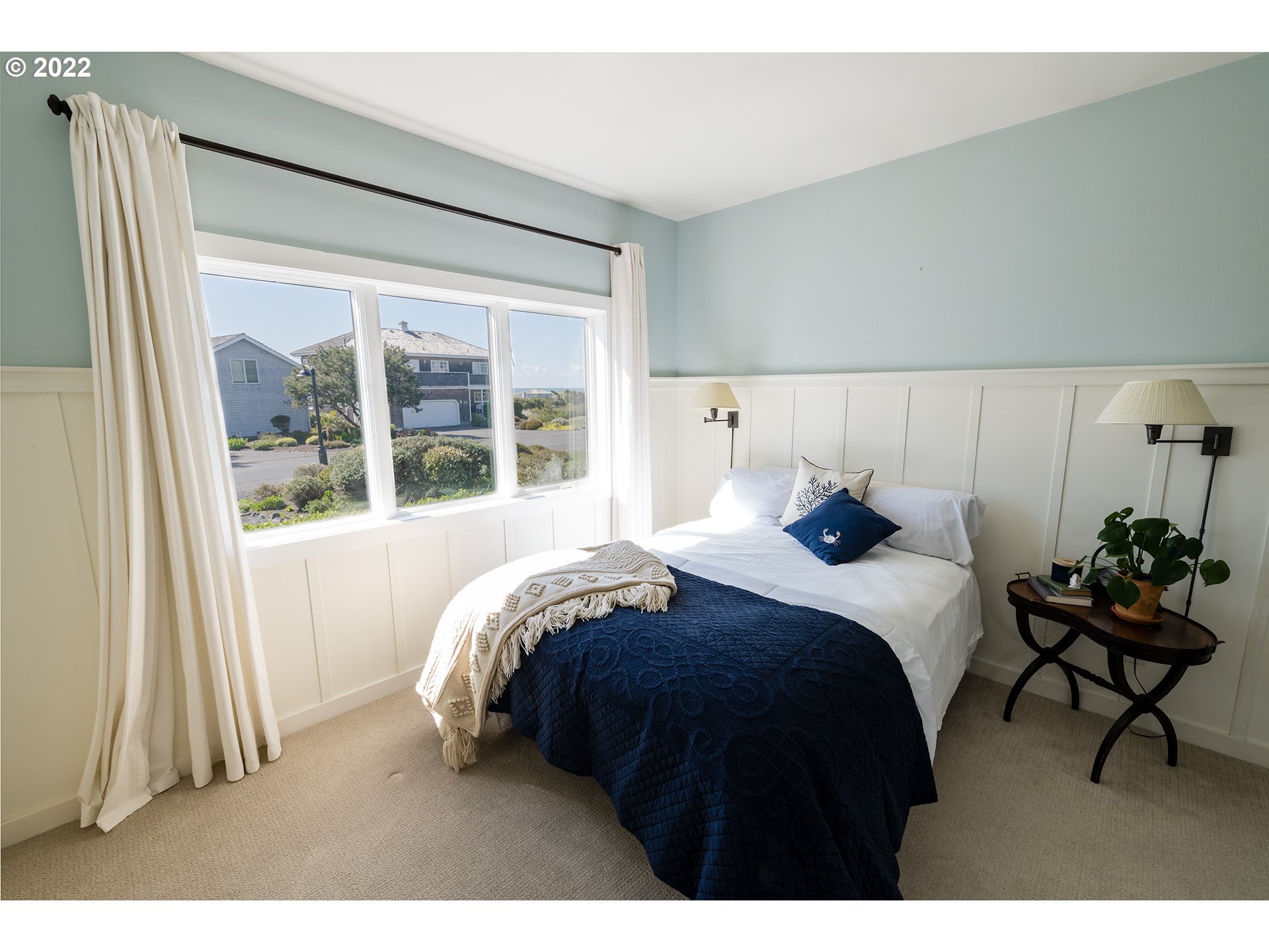 4805 High Ridge Road Gearhart, OR 97138 - Photo 21 of 29 a bedroom with a bed and window