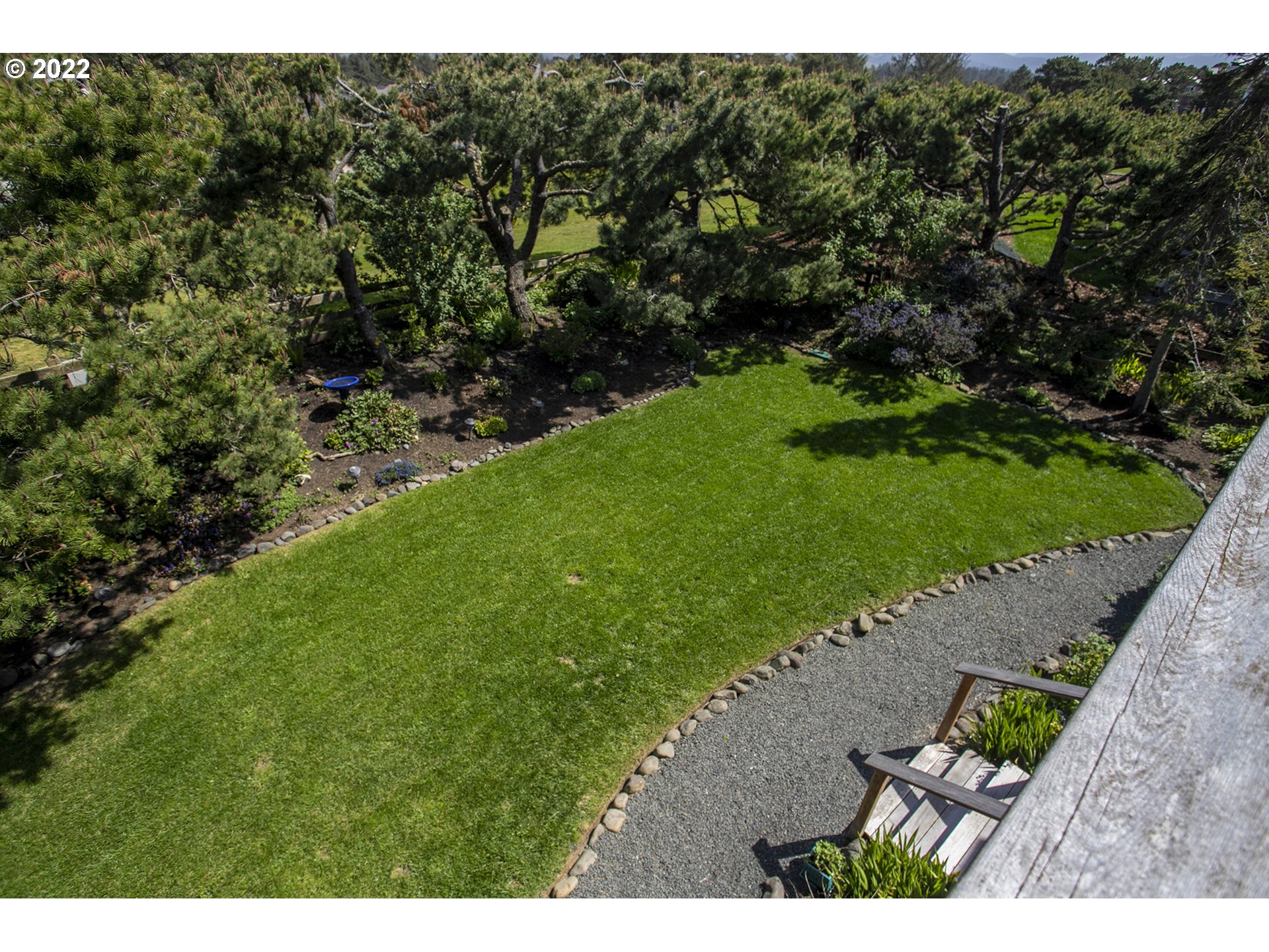4805 High Ridge Road Gearhart, OR 97138 - Photo 25 of 29 a view of a yard with plants