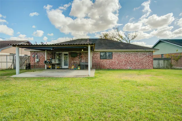 a view of a house with a swimming pool and porch