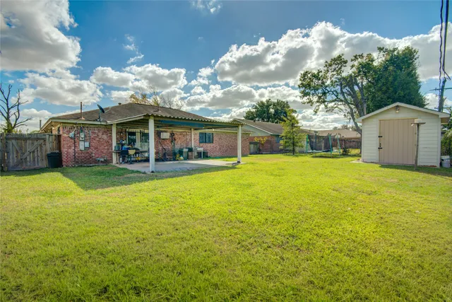 a view of house with outdoor space and swimming pool