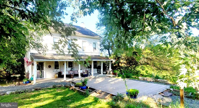 a view of a tiny house with a yard