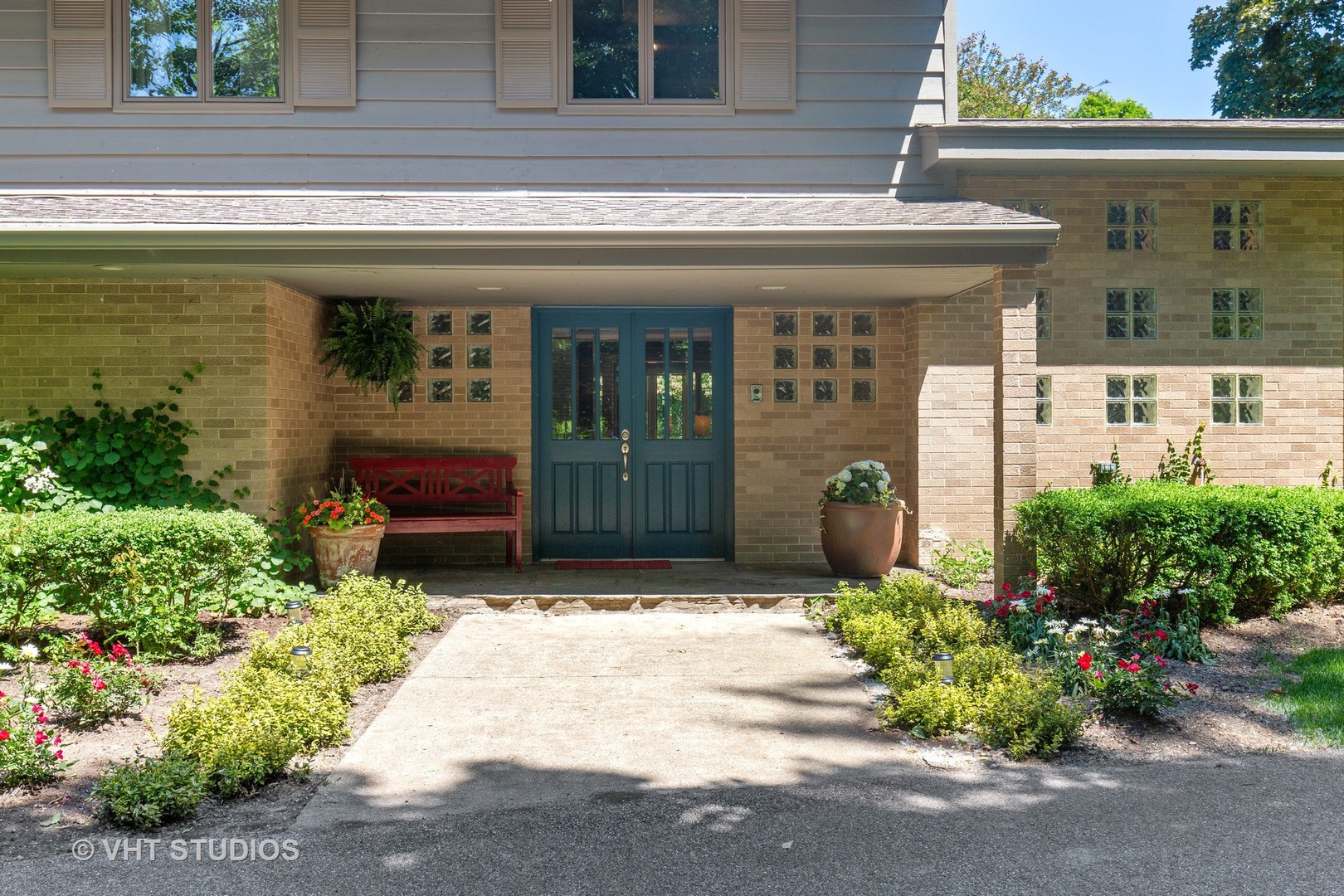 465 Riverside Drive Crystal Lake, IL 60014 - Photo 3 of 30 a front view of a house with a lots of potted plants