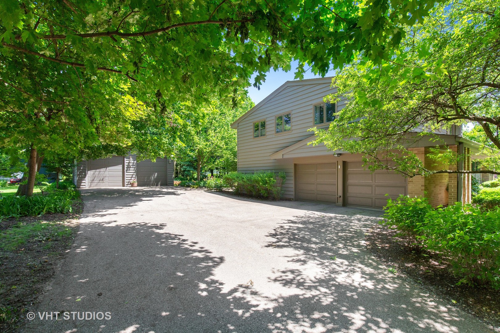 465 Riverside Drive Crystal Lake, IL 60014 - Photo 29 of 30 a front view of a house with a yard and a garage