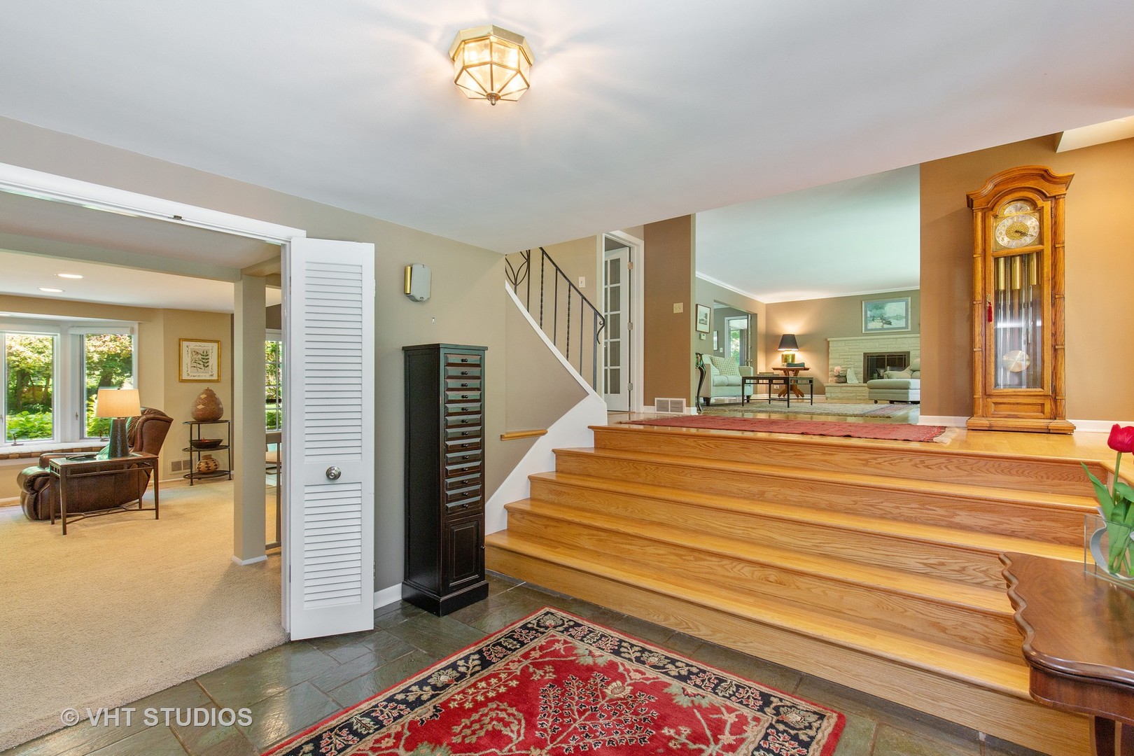 465 Riverside Drive Crystal Lake, IL 60014 - Photo 5 of 30 a bedroom with a bed and a chandelier