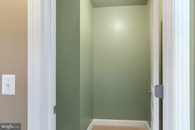 a view of a room with racks on the wall