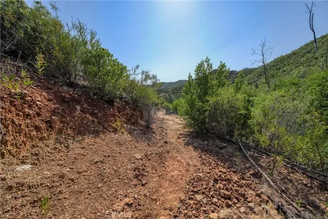 a view of a large mountain with an ocean