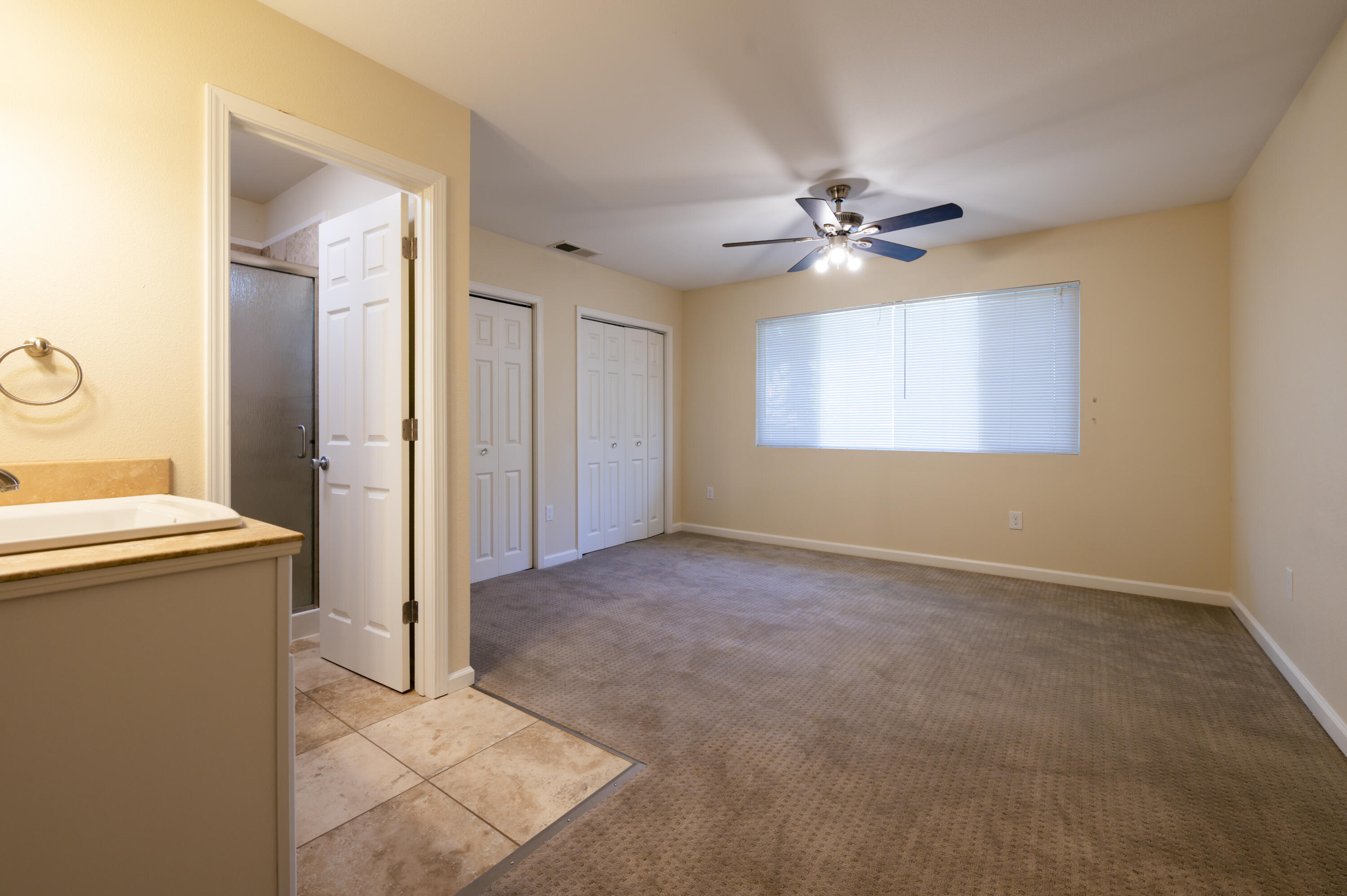 601 Green Street Willows, CA 95988 - Photo 12 of 23 an empty room with windows and fan