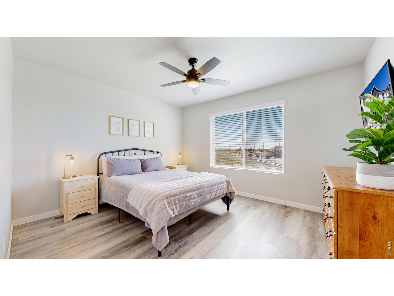 260 Pawnee Road, Unit D3 Ault, CO 80610 - Photo 19 of 44 Primary bedroom has open views, LVP flooring, closet and ceiling fan.
