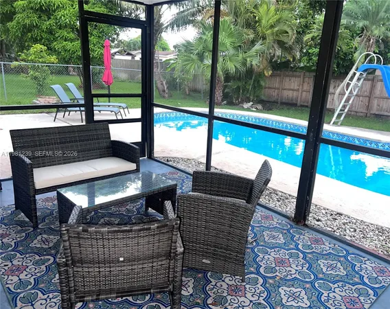 a view of outdoor sitting area with furniture