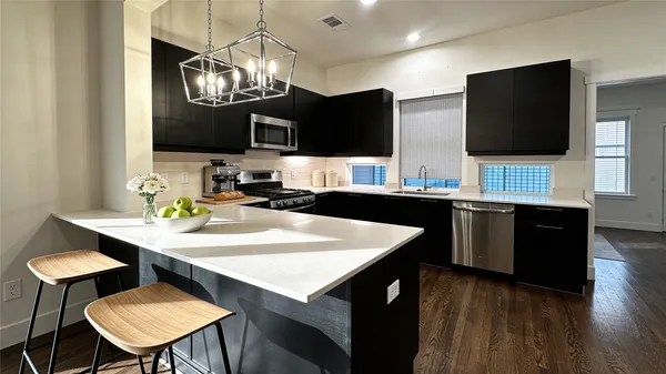 a kitchen with a dining table and chairs