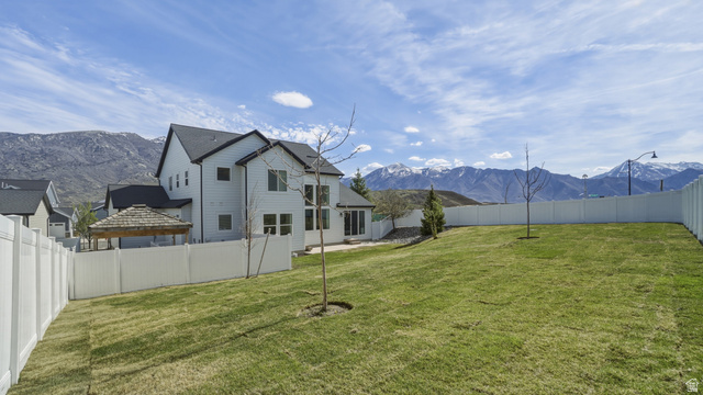 15008 South Springtime Road Draper, UT 84020 - Photo 7 of 37 Fenced backyard featuring a mountain view