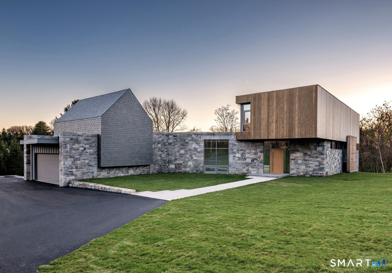314 Ferry Road Old Lyme, CT 06371 - Photo 34 of 40 The understated front was intentionally designed with a more private facade to ensure optimum privacy.