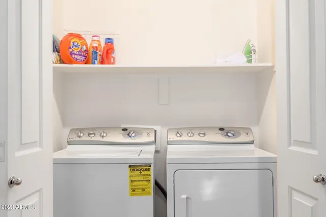 a utility room with dryer and washer
