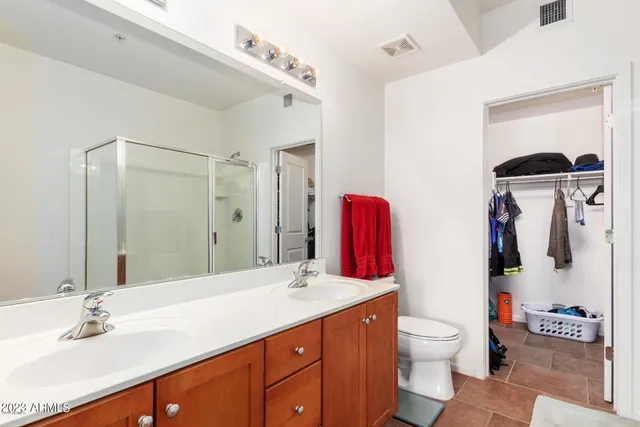 a view of a hallway with paintings on the wall