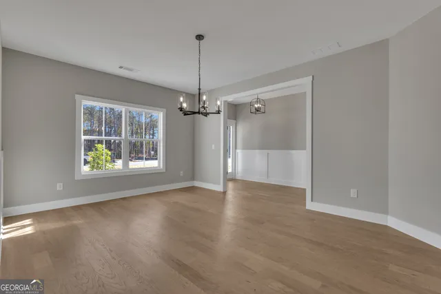a kitchen with kitchen island granite countertop a sink a counter top space stainless steel appliances and cabinets