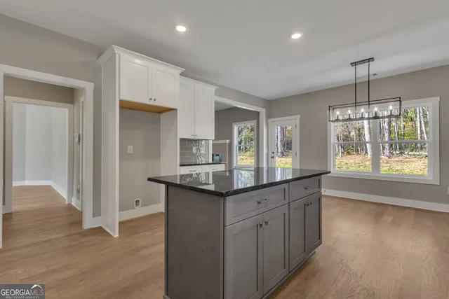 a view of cabinets and wooden floor