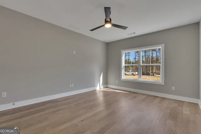 a bathroom with a toilet and a bathtub