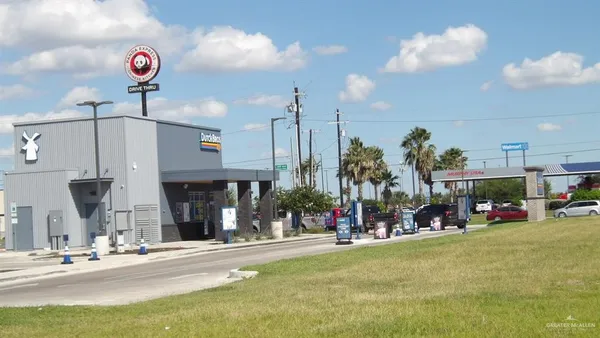 a view of a street with cars
