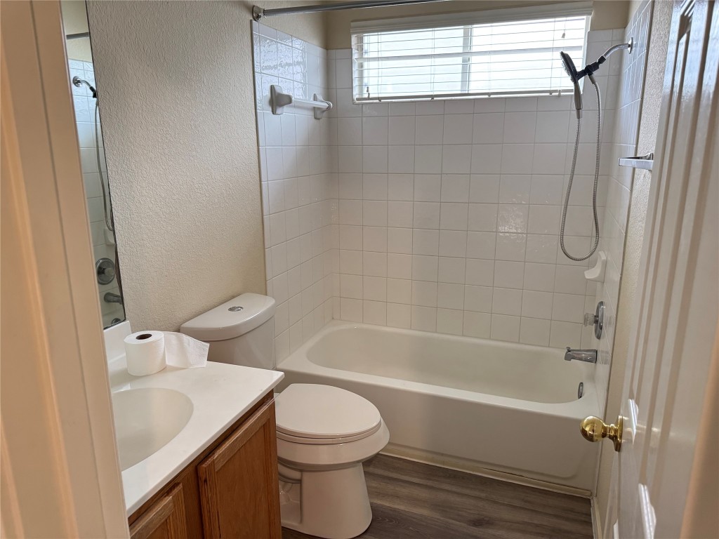 501 Grey Feather Court Round Rock, TX 78665 - Photo 16 of 28 a bathroom with a sink toilet and shower